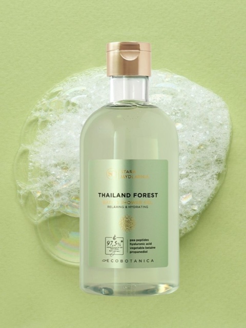 Żel do kąpieli i pod prysznic Thailand Forest 400 ml – Stara Mydlarnia, w tle kleks z pianki z kąpieli